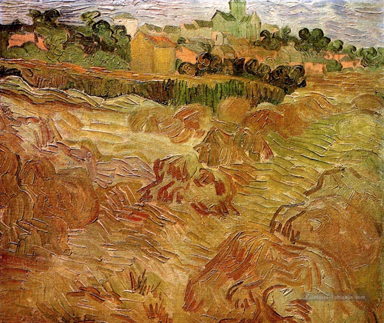 Champs de blé avec Auvers en arrière plan Vincent van Gogh Peintures à l'huile